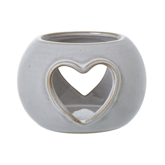 White ceramic tealight holder with cutout heart shape. Measures 9 x9 x 6 centimetres. 