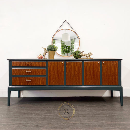 Beithcraft mid century Sideboard, a rare find  comes with 3 Drawers sitting above each other on the left hand side, two cupboards both the two doors sitting centrally and on the righthand side.  design painted in green varnished in  satin osmo oil 