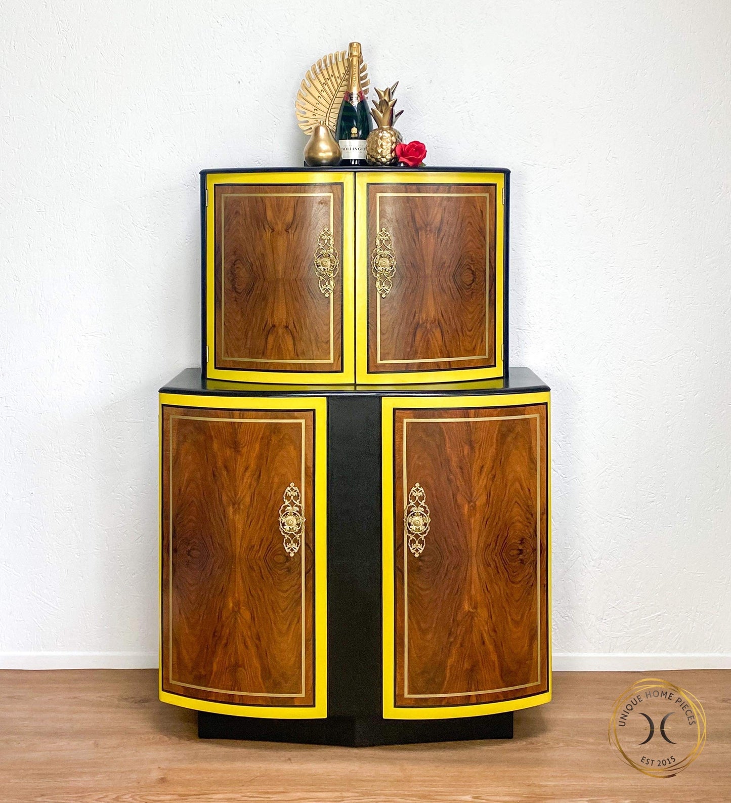Stonehill cocktail cabinet, painted black internall and externally with the doors having a yellow, black and gold stripe detailing. sealed with osmo oil to protect the wanut wood grain. 